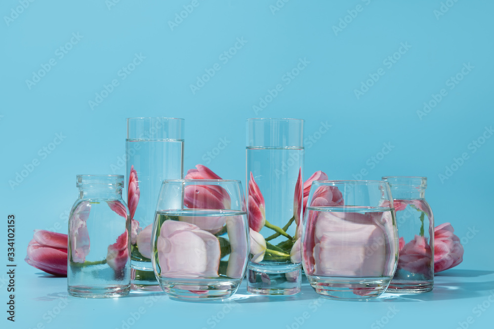 Spring fresh pink distorted through liquid water on blue. Spring fresh pink distorted through liquid water on blue.