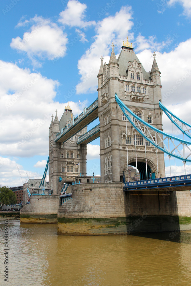 Obraz premium Tower Bridge with the blue sky and clouds on a bright sunny day in spring, London, UK
