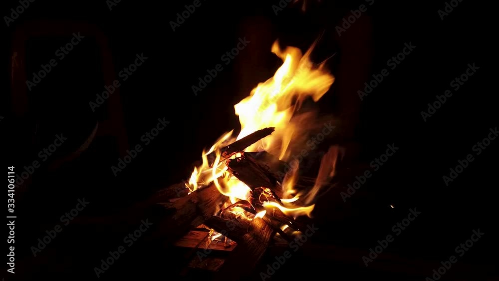 Bonfire sparkle heat at night camp with friends and family during the summer holiday use as background Bonfire sparkle heat at night camp with friends and family during the summer holiday use as background