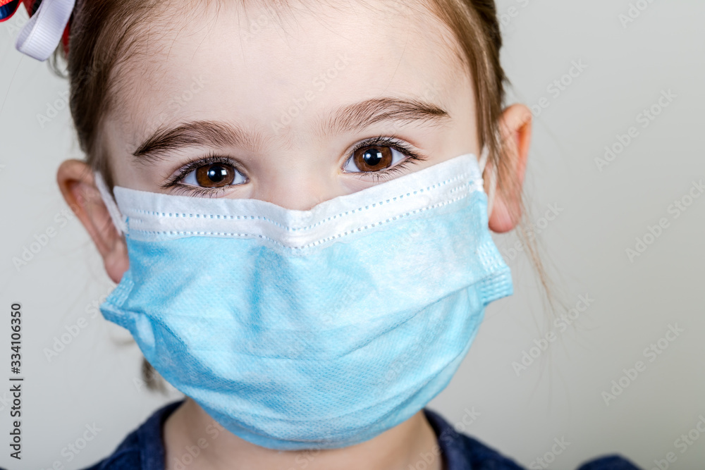 Little girl has fabric mask protect herself from Coronavirus COVID-19 Little girl has fabric mask protect herself from Coronavirus COVID-19