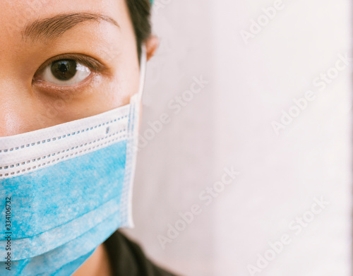 Focus: Asian Doctor Wearing a Mask against Coronavirus.