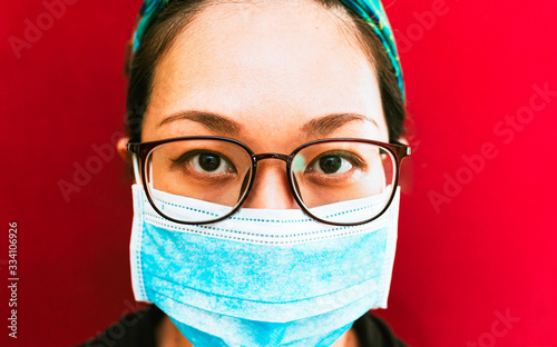  Woman Wearing a Mask against Coronavirus  looking Concentrated.
