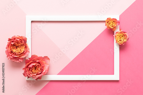 Happy Mother's Day, Women's Day, Valentine's Day or Birthday Pastel Pink Colored Background.  Floral flat lay mock up greeting card with beautiful roses.