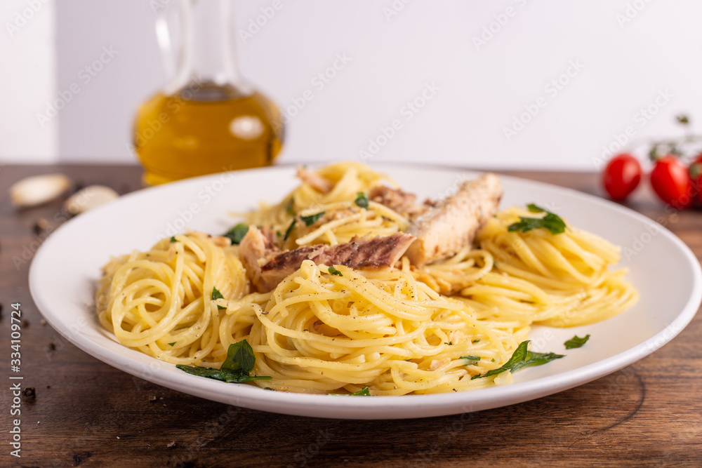 Seafood spaghetti with garlic and parsley. Healthy and nutritious Italian food. Blue fish, omega 3 recipe. Seafood spaghetti with garlic and parsley. Healthy and nutritious Italian food. Blue fish, omega 3 recipe.