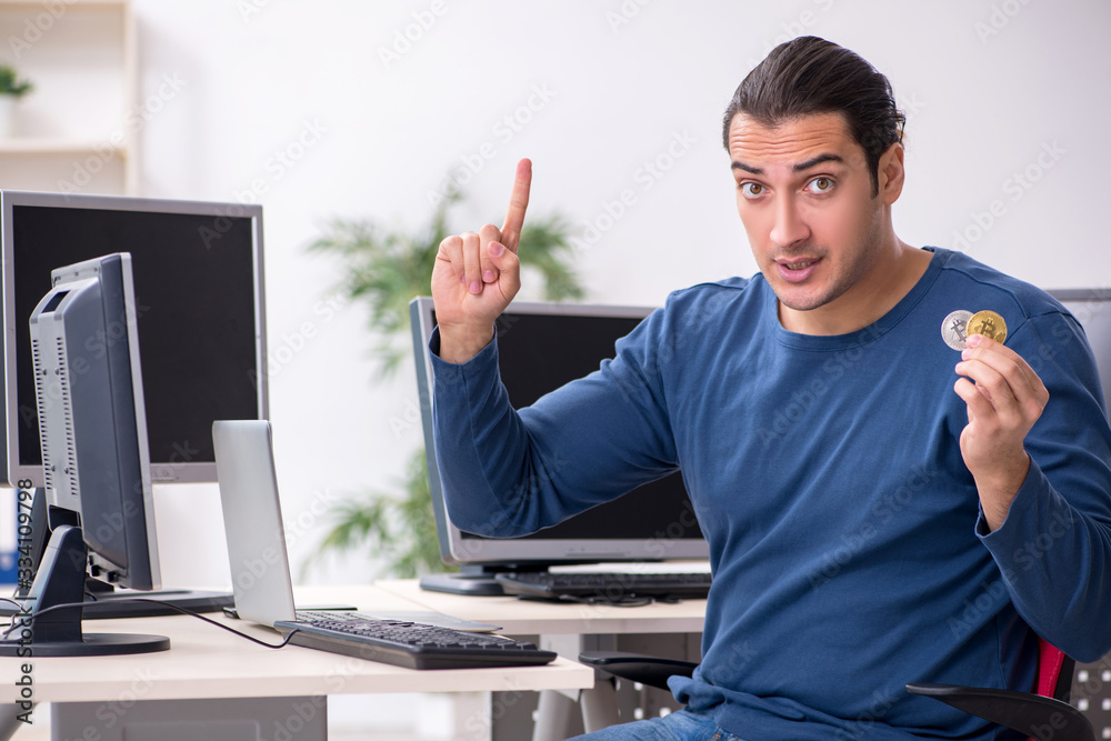 Young male it specialist working in the office Young male it specialist working in the office