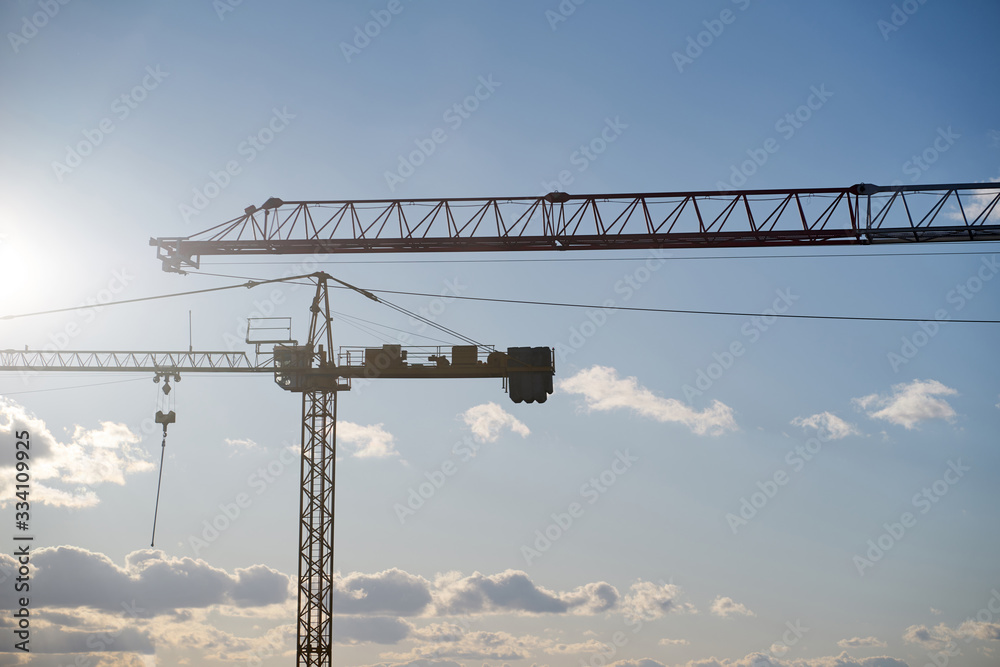 Working cranes on a blue sky background