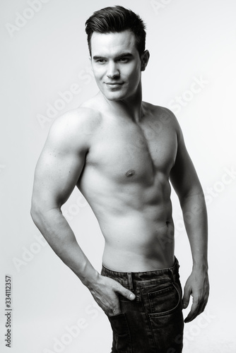 Young handsome man shirtless in black and white