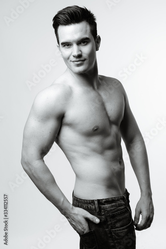 Young handsome man shirtless in black and white