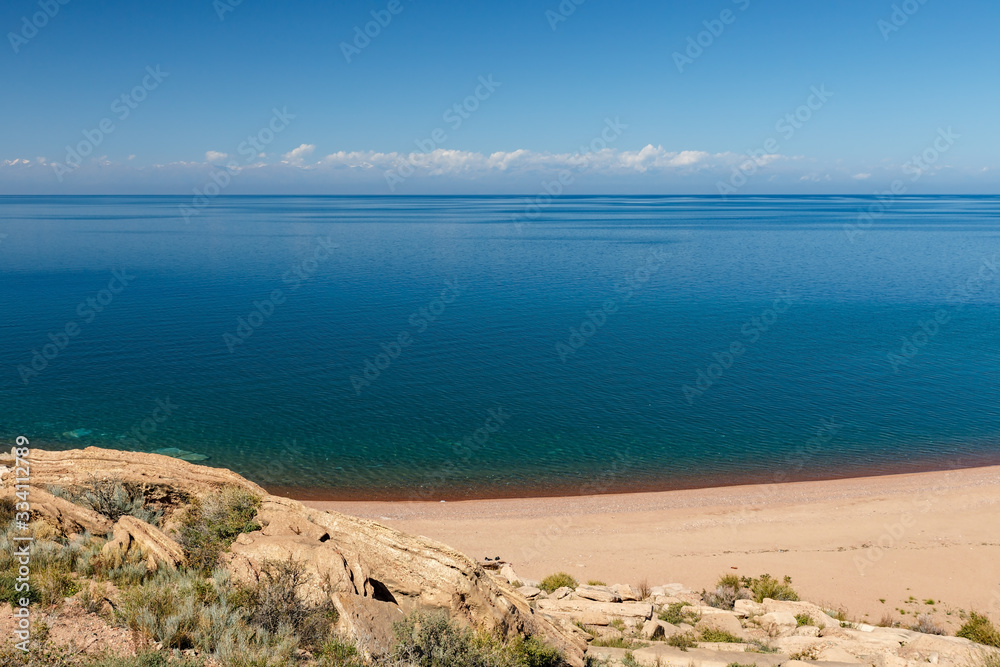 Issyk-Kul Lake, empty sandy beach on the southern shore of the lake, Kyrgyzstan