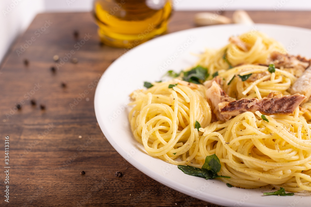  Seafood spaghetti with garlic and parsley. Healthy and nutritious Italian food. Blue fish, omega 3 recipe.