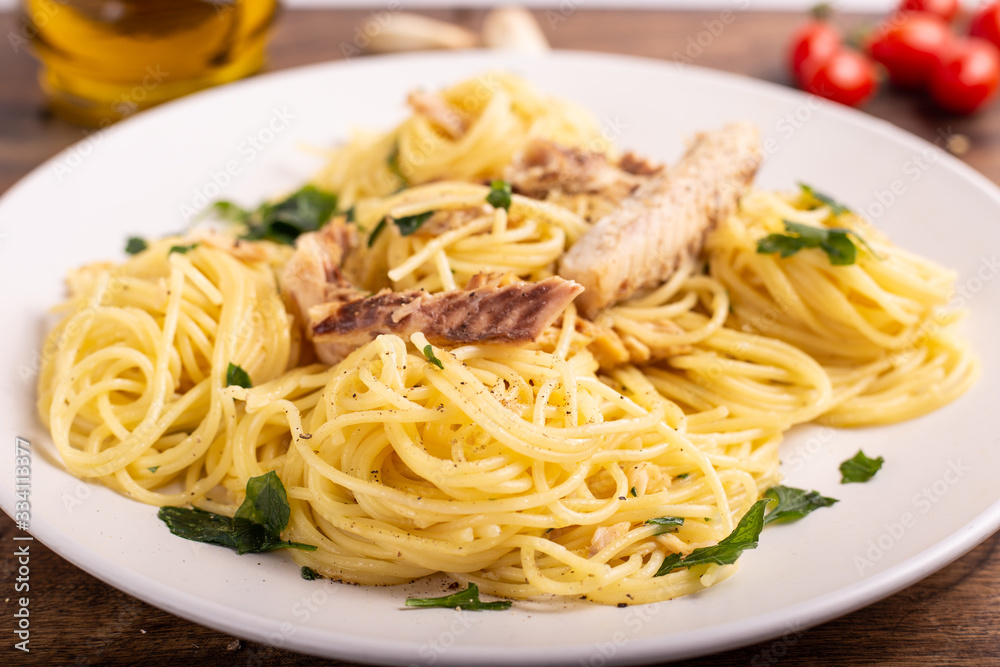 Seafood spaghetti with garlic and parsley. Healthy and nutritious Italian food. Blue fish, omega 3 recipe. Seafood spaghetti with garlic and parsley. Healthy and nutritious Italian food. Blue fish, omega 3 recipe.