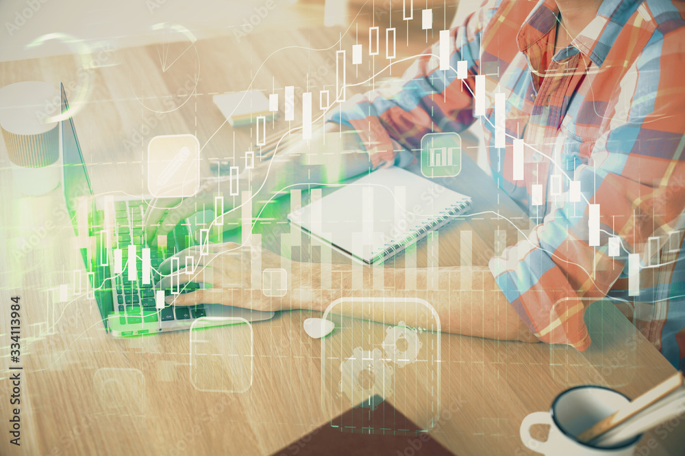 Multi exposure of forex graph with man working on computer on background. Concept of market analysis. Multi exposure of forex graph with man working on computer on background. Concept of market analysis.