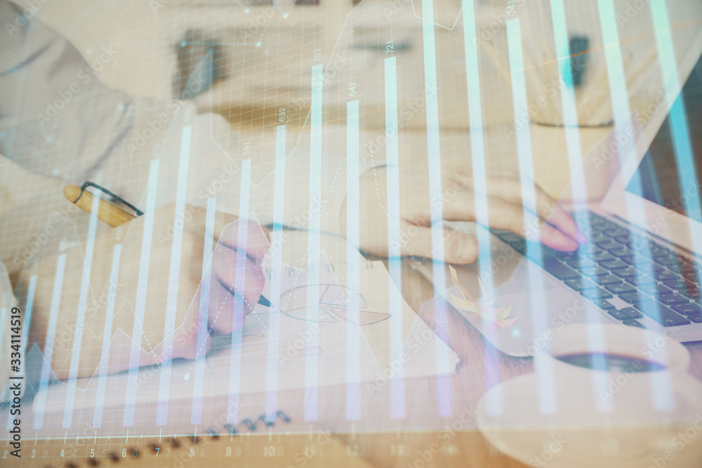 Multi exposure of stock market graph with man working on laptop on background. Concept of financial analysis. Multi exposure of stock market graph with man working on laptop on background. Concept of financial analysis.