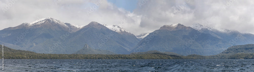lake and snow on Hunter range, near Manapouri, New Zealand