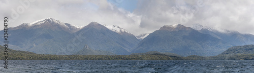 lake and snow on Hunter range, near Manapouri, New Zealand