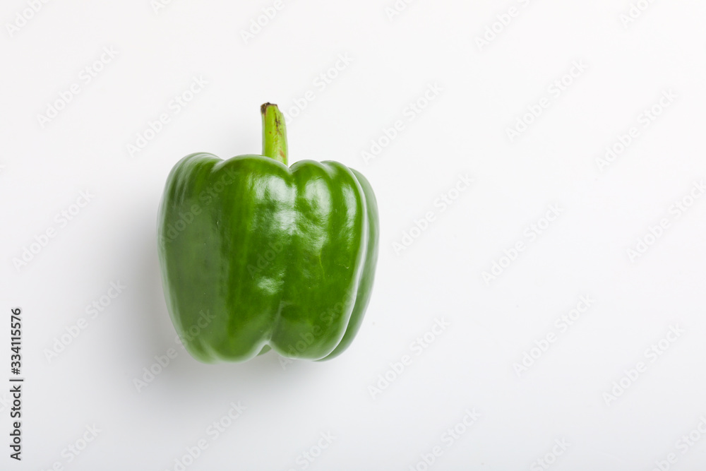 fresh green bell pepper (capsicum) on a white background fresh green bell pepper (capsicum) on a white background