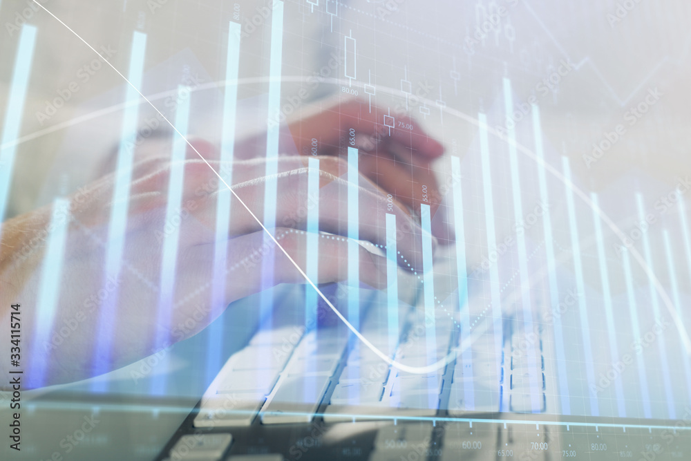Double exposure of graph with man typing on computer in office on background. Concept of hard work. Closeup. Double exposure of graph with man typing on computer in office on background. Concept of hard work. Closeup.