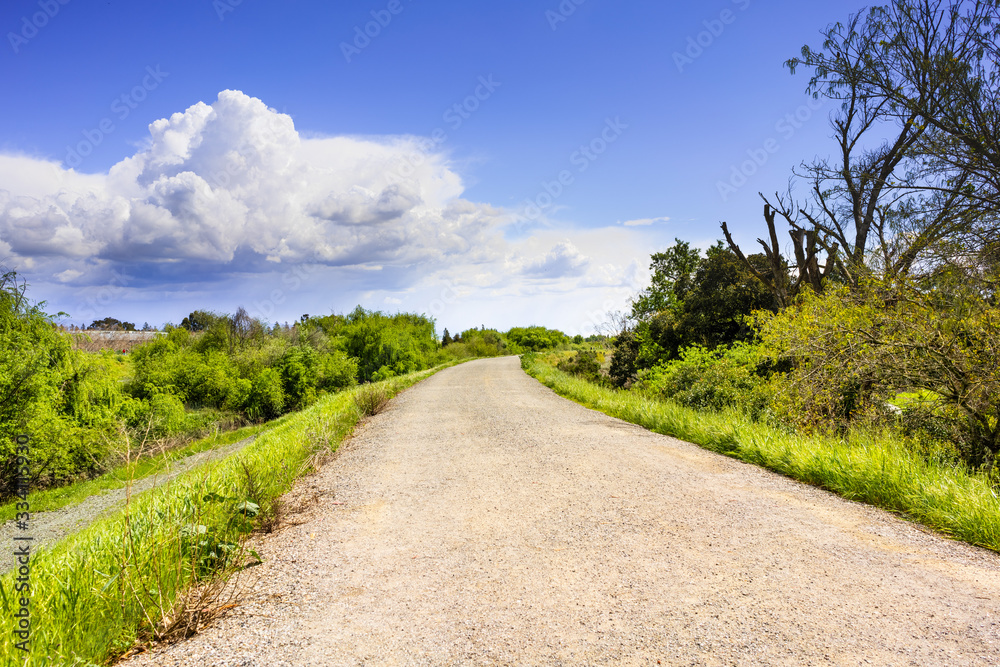 Walking trail on the shoreline of Guadalupe River, Santa Clara, South San Francisco Bay Area, California