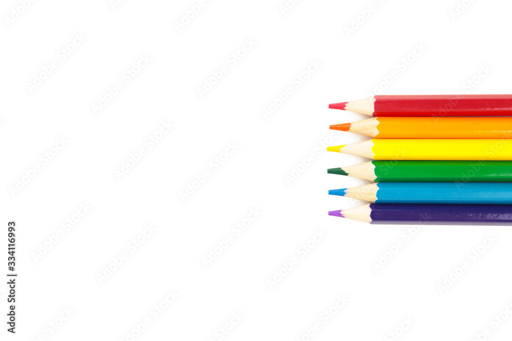 LGBT pride rainbow flag made of six colored pencils on white