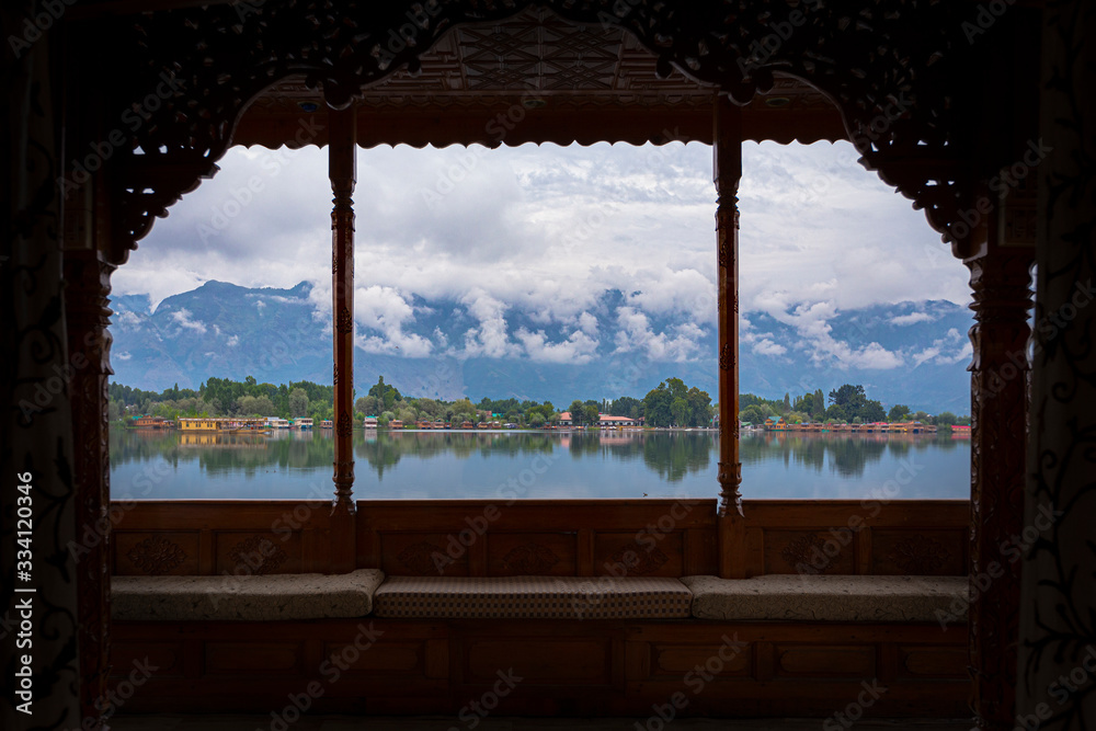 Peacefully Dal lake with snow mountain background in Srinagar, Kashmir India Peacefully Dal lake with snow mountain background in Srinagar, Kashmir India