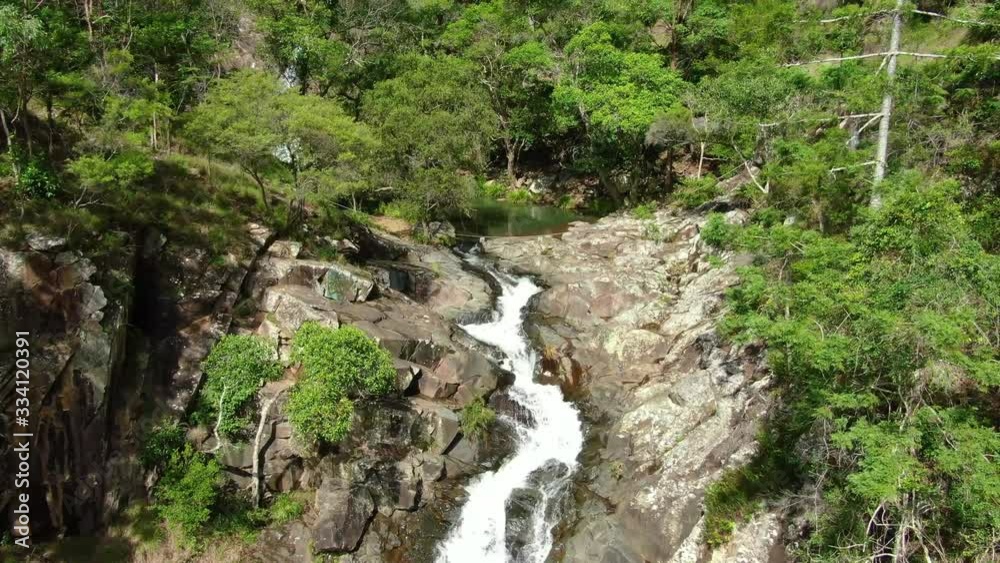 Flying upstream of fast flowing creek, Summers day, Australian bushland Flying upstream of fast flowing creek, Summers day, Australian bushland