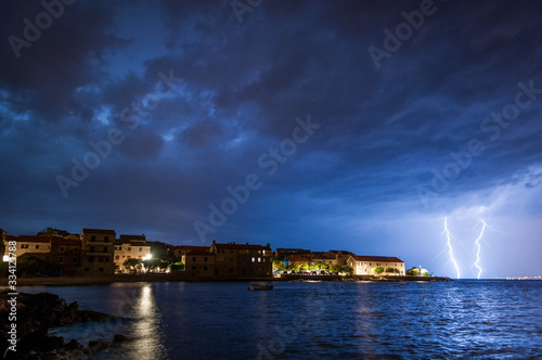 Night view of a city with lightning photo