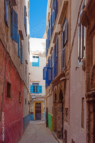 View of the narrow city street Essaouira, Morocco. Vertical. © ggfoto