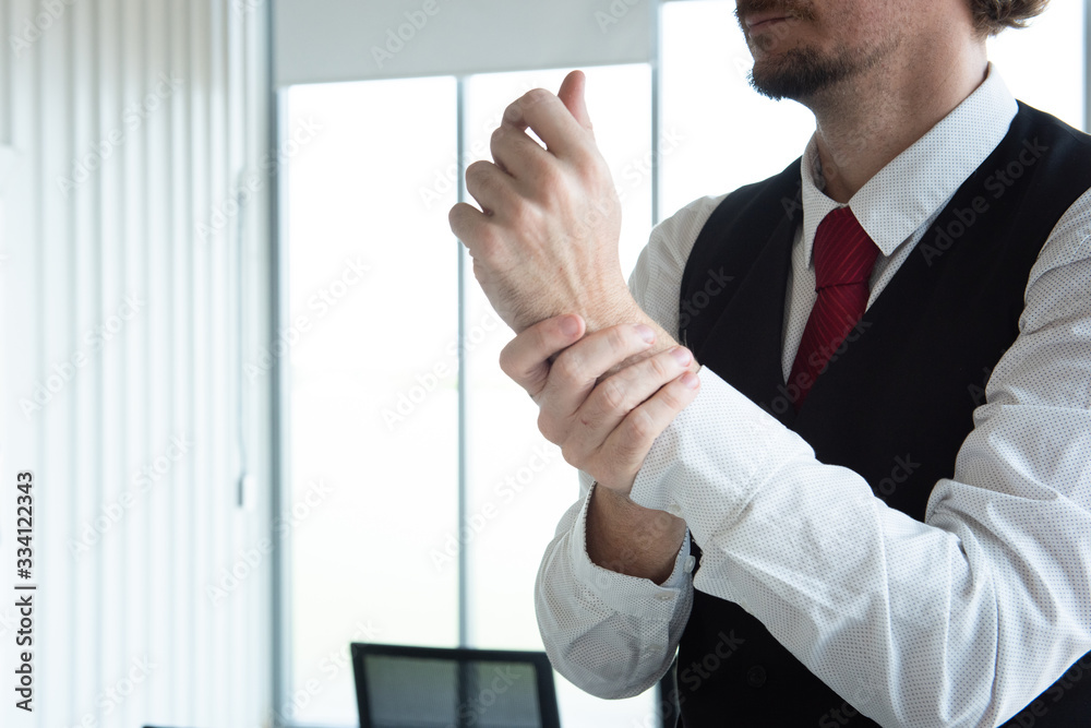 Caucasian business man in office using alcohol gel and rubbing hands back and forth to kill virus. protect from coronavirus or covid-19 virus world pandemic,health care and medicine concept. Caucasian business man in office using alcohol gel and rubbing hands back and forth to kill virus. protect from coronavirus or covid-19 virus world pandemic,health care and medicine concept.
