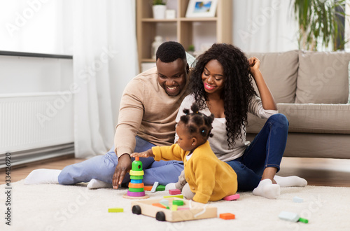 Bild auf Leinwand family, parenthood and people concept - happy african american mother, father an