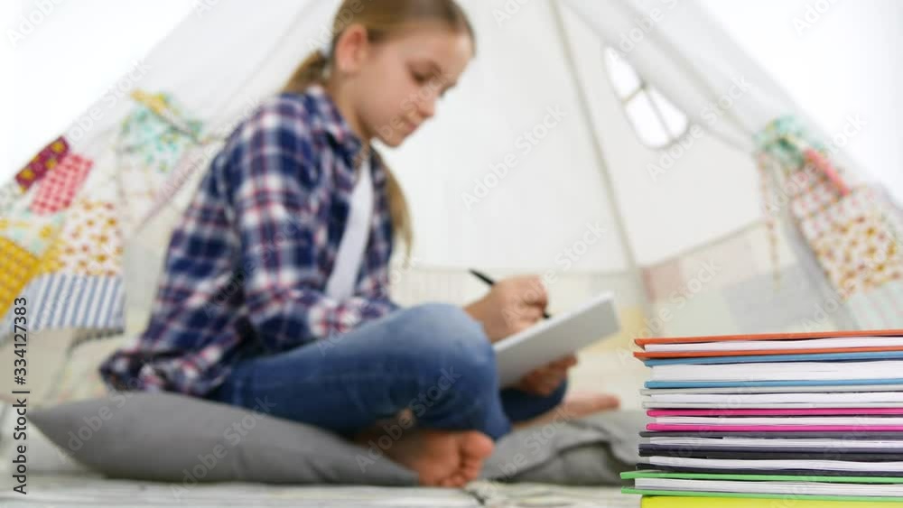 Child Playing Tablet in Playroom Girl Writing Homework for School Kid Playground Child Playing Tablet in Playroom Girl Writing Homework for School Kid Playground