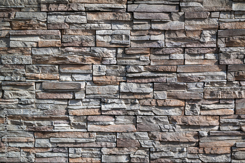 Irregular square-sized natural stone background and texture