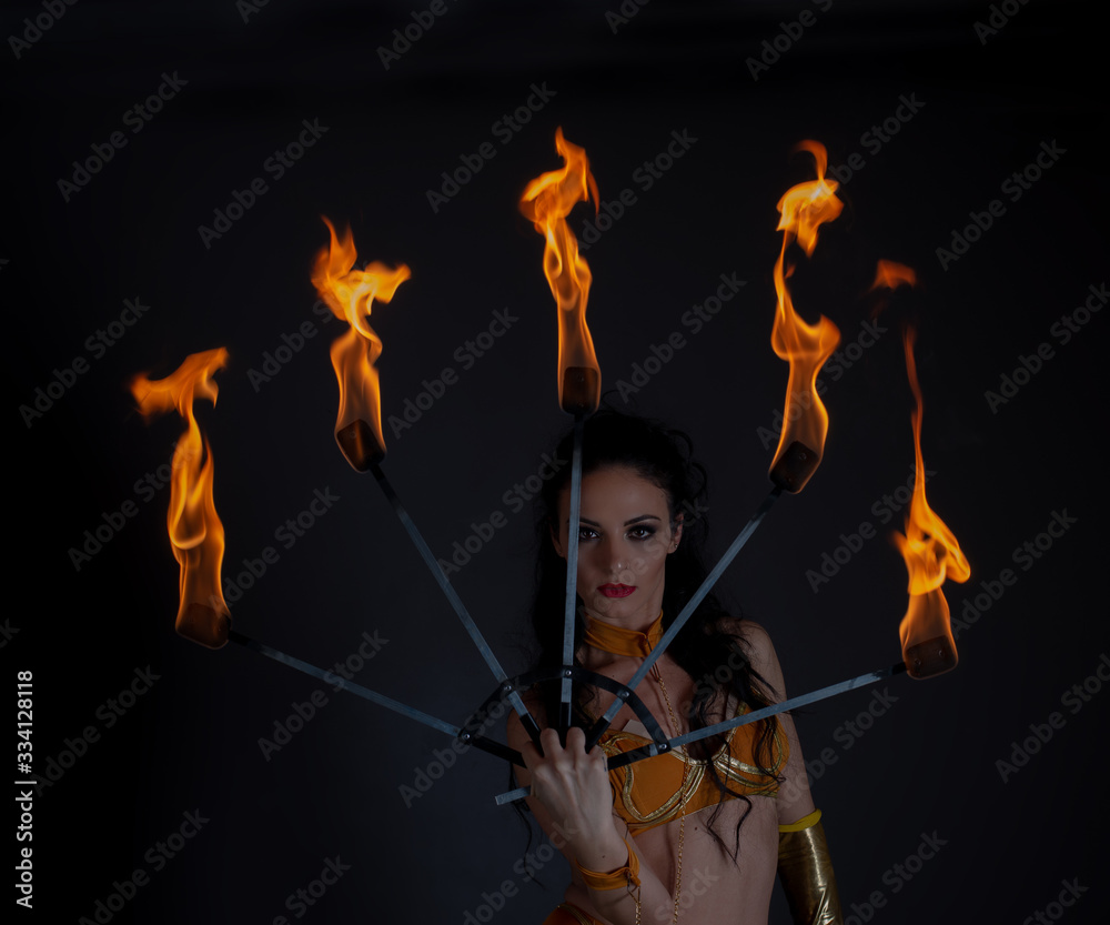 juggler girl performing fire games 