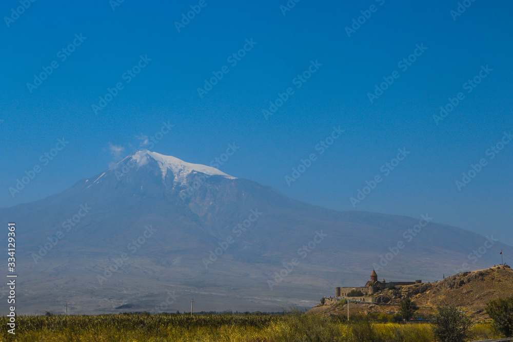View of mount Ararat in Turkey from the territory of Armenia from the monastery of Khor Virap at noon in summer in cloudless weather