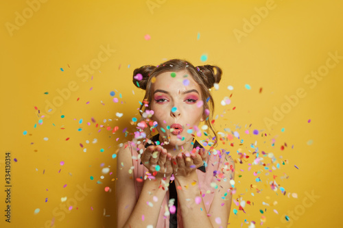 Beautiful woman and colorful confetti
