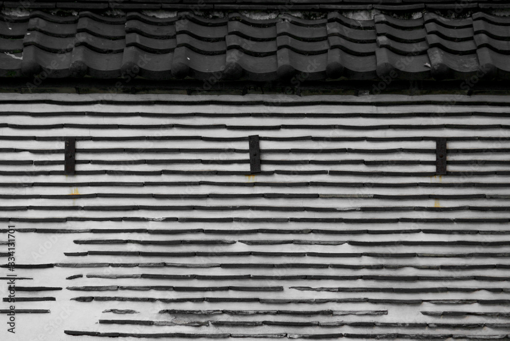 Fototapeta premium Old Japanese clay wall using roof tile