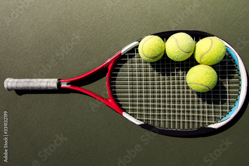 Tennis racket and tennis ball on the tennis court © PEETPhoto