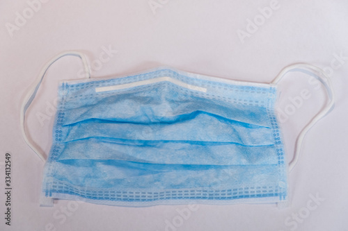 Surgical face mask on white background