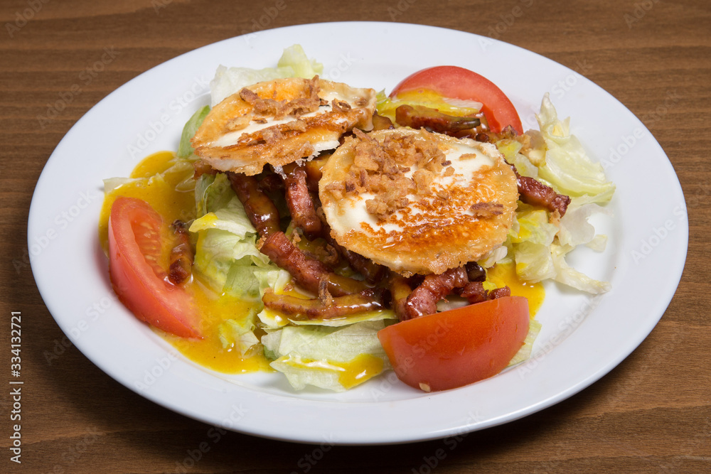 A plate of warm goat cheese salad. A plate of warm goat cheese salad.