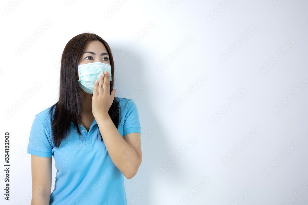 Asian women wear masks to prevent disease covid 19, long haired-black women. Wearing a blue collar shirt. Woman covering her mouth on white background. Asian women wear masks to prevent disease covid 19, long haired-black women. Wearing a blue collar shirt. Woman covering her mouth on white background.
