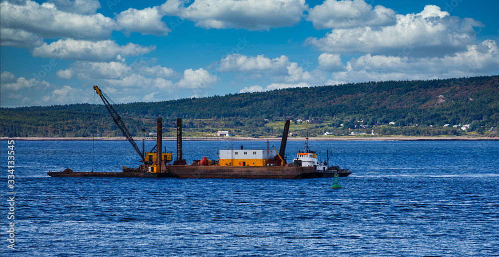 A working barge off the coast of Nova Scotia Canada