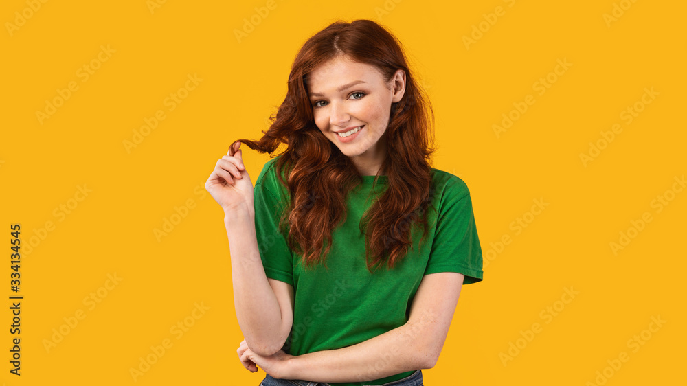 Teen Girl Playing With Hair Posing Over Yellow Background, Panorama Teen Girl Playing With Hair Posing Over Yellow Background, Panorama