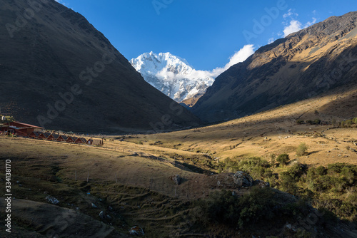 Rocky paths and green valleys surrounded by snowcapped mountains on the Salkantay Trek, Peru © nielsvos