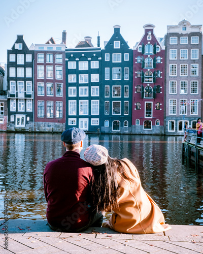 Photography Amsterdam Damrak during sunset, happy couple man and woman on a summer evening a