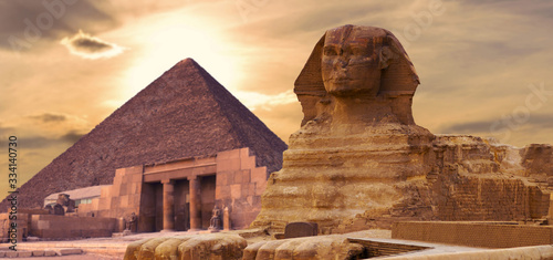 Sphinx against the backdrop of the great Egyptian pyramids. Africa, Giza Plateau. photo