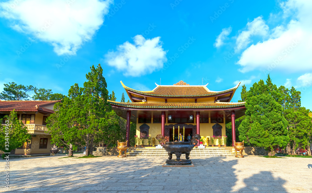 Fototapeta premium View in fron of Truc Lam monastery is an ancient temple to attract tourists. This place cultivates many Buddhists who are helpful to everyone in Da Lat, Vietnam
