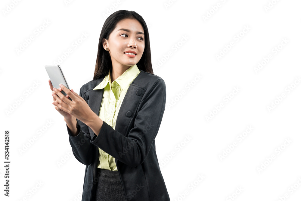 Asian businesswoman standing while using mobile phone Asian businesswoman standing while using mobile phone