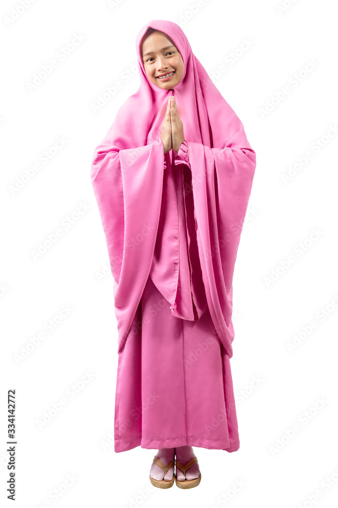 Asian Muslim woman in veil praying