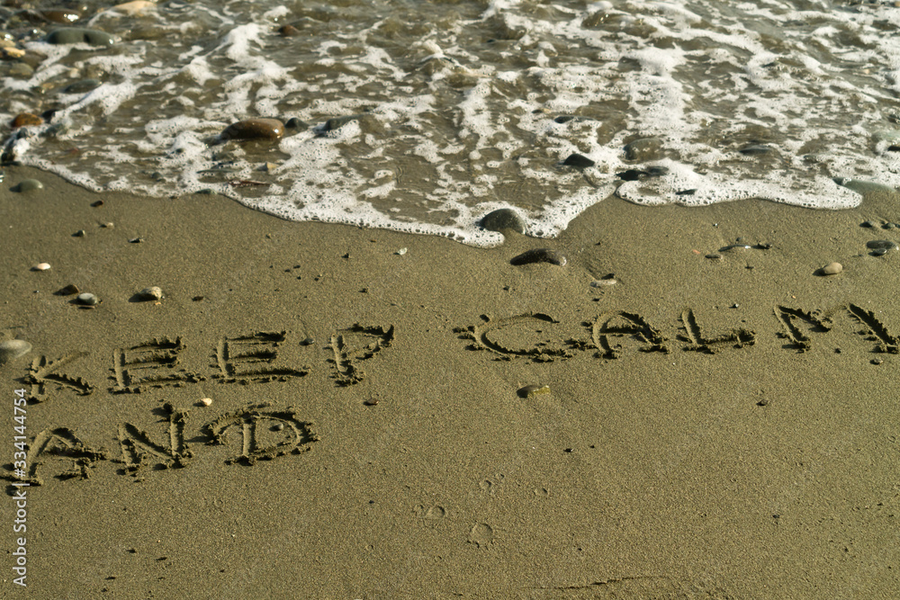 Fototapeta premium Words on beach sand with copy space