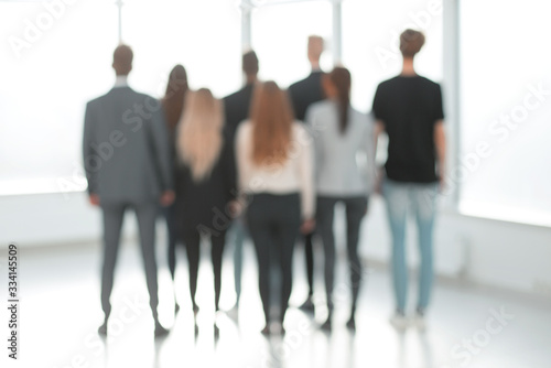 rear view. blurry image of a group of young business people © ASDF