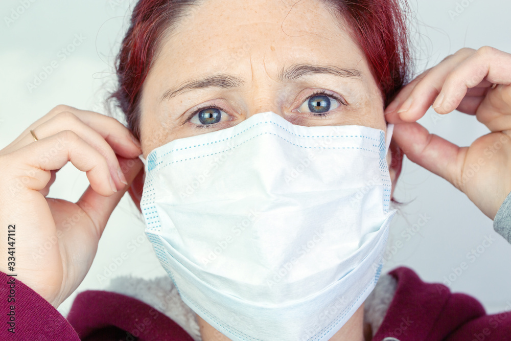 Person with medical mask for protection against flu and diseases Person with medical mask for protection against flu and diseases